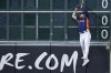 Houston Astros left fielder Chas McCormick makes a leaping catch on a fly ball hit by Seattle Mariners' Teoscar Hernandez during the second inning of a baseball game, Sunday, July 9, 2023, in Houston. (AP Photo/Kevin M. Cox)