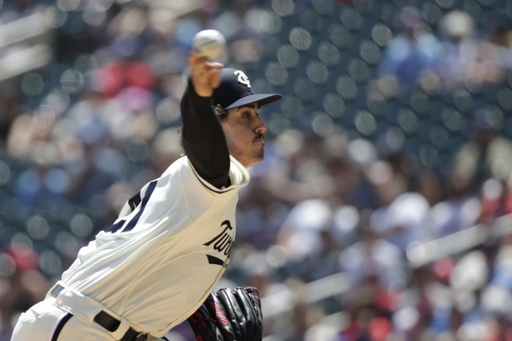 Minnesota Twins starting pitcher Joe Ryan throws to the Baltimore Orioles in the first inning of a baseball game Sunday, July 9, 2023, in Minneapolis. (AP Photo/Andy Clayton-King)