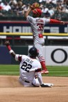 Chicago White Sox's Oscar Colas (22) reaches second base under St. Louis Cardinals shortstop Jose Fermin (35) during the third inning of a baseball game, Sunday, July 9, 2023, in Chicago. (AP Photo/Matt Marton)