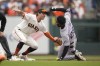 Colorado Rockies' Jurickson Profar is tagged out at second base by San Francisco Giants shortstop Casey Schmitt in the first inning of a baseball game in San Francisco, Sunday, July 9, 2023. Profar singled to right field and was stretching to second on the play. (AP Photo/Eric Risberg)