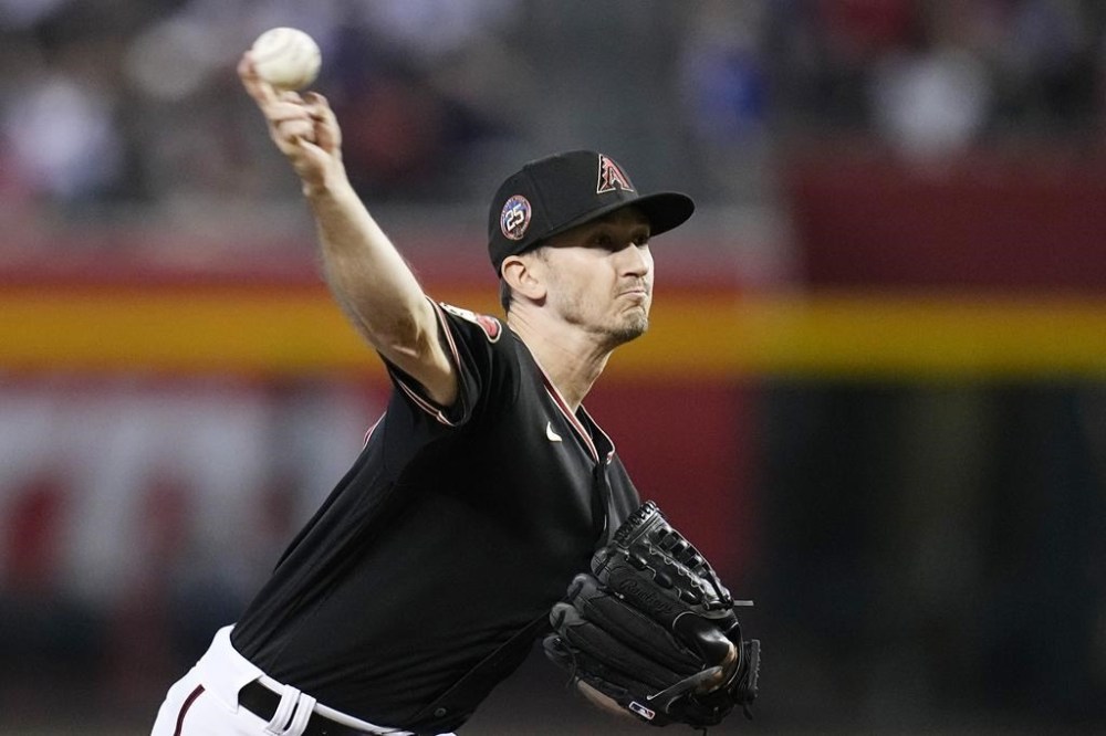 Arizona Diamondbacks starting pitcher Zach Davies throws against the Pittsburgh Pirates during the first inning of a baseball game, Sunday, July 9, 2023, in Phoenix. (AP Photo/Ross D. Franklin)