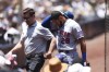 New York Mets' Tommy Pham (28) walks off the field with a trainer in the first inning of a baseball game against the San Diego Padres, Sunday, July 9, 2023, in San Diego. (AP Photo/Derrick Tuskan)