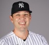 FILE - Dillon Lawson, of the New York Yankees baseball team, poses for a photo in Tampa, Fla., Feb. 22, 2023. Lawson was fired by the Yankees after a loss Sunday, July 9, 2023, to the Chicago Cubs, a rare midseason change by a franchise that has prized stability since Hal Steinbrenner took over from his father as controlling owner. (AP Photo/David J. Phillip, File)