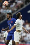United States midfielder Gianluca Busio (6) and Canada midfielder Jonathan Osorio (21) vie for a loose ball during a CONCACAF Gold Cup semi-final soccer match, Sunday, July 9, 2023, in Cincinnati. (AP Photo/Michael Conroy)