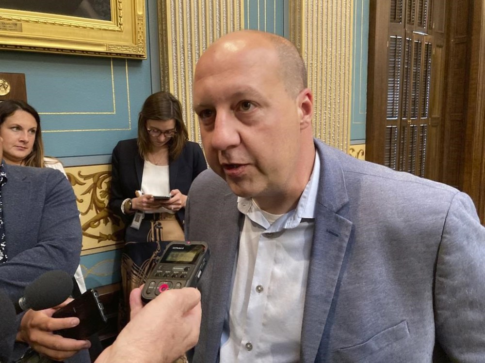 FILE - Sen. Curtis Hertel Jr., D-East Lansing, speaks with reporters in the Senate chamber following the approval of a $17.1 billion K-12 budget on Wednesday, June 30, 2021, in Lansing, Mich. Hertel Jr. and Tom Barrett, a Republican, will both announce campaigns for Michigan's 7th Congressional District on Monday, July 10, 2023. The two candidates are the first to announce campaigns for the open seat and are both expected to be the frontrunners to win their party’s nominations. (AP Photo/David Eggert, File)