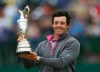 FILE - Rory McIlroy of Northern Ireland holds up the Claret Jug trophy after winning the British Open Golf championship at the Royal Liverpool golf club, Hoylake, England, July 20, 2014. Golf’s major championship season comes to a close at the British Open. It's the last chance of the year for Rory McIlroy to end his nine-year drought in the majors. At least the territory will be familiar. Royal Liverpool in Hoylake, England, is the site of the 151st edition of golf’s oldest championship, which begins Thursday, July 20. (AP Photo/Scott Heppell, File)