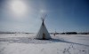 A teepee is shown as Christopher Traverse, Chief of Lake St. Martin First Nation speaks to the media at Winnipeg's Brady Landfill just outside the city, Thursday, April 6, 2023. A protest at a city-owned landfill south of Winnipeg remains in place after they were ordered to leave. THE CANADIAN PRESS/John Woods