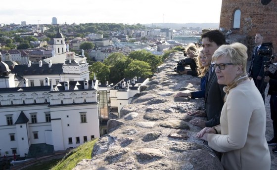 Lithuanian Prime Minister Ingrida Simonyte, Prime Minister Justin Trudeau and Foreign Affairs Minister Melanie Joly take in the view from the Gediminas Castle tower in Vilnius, Lithuania, Monday. (Adrian Wyld / The Canadian Press)
