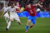 FILE - Czech Republic's David Jurasek, right, and Poland's Robert Gumny vie for the ball during the Euro 2024 Group E qualifying soccer match between Czech Republic and Poland at the Sinobo stadium in Prague, Czech Republic, on March 24, 2023. Jurasek has completed a transfer from Slavia Prague to Portugal champion Benfica Lisbon. The two confirmed confirmed the move on Monday July 10, 2023 after the 22-year old passed a medical test in Lisbon. (AP Photo/Petr David Josek, File)