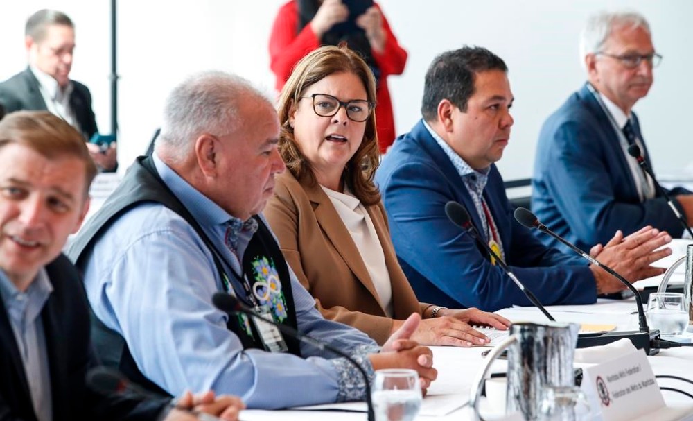 Heather Stefanson, Chair, Council of the Federation, and Premier of Manitoba talks with David Chartrand, Manitoba Metis Federation president, at the Canadian premiers and National Indigenous Organizations meeting in Winnipeg, Monday, July 10, 2023. THE CANADIAN PRESS/John Woods
