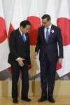 Japan's Prime Minister Fumio Kishida, left, is greeted by his Polish host, Prime Minister Mateusz Morawiecki, right, ahead of their talks on regional security, war in Ukraine and bilateral cooperations in Warsaw, Poland, Tuesday, July 11, 2023. Kishida made a stop in Warsaw on his way to NATO summit in Vilnius, Lithuania. (AP Photo/Czarek Sokolowski)