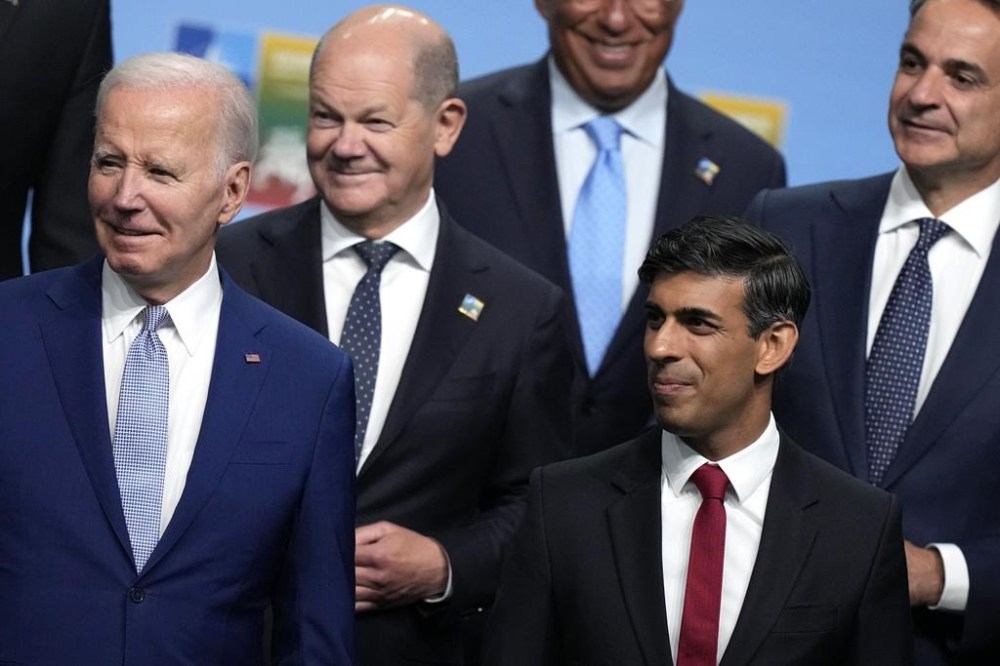 From left, United States President Joe Biden, Germany's Chancellor Olaf Scholz, Portugal's Prime Minister Antonio Costa, British Prime Minister Rishi Sunak and Greece's Prime Minister Kyriakos Mitsotakis during a group photo at a NATO summit in Vilnius, Lithuania, Tuesday, July 11, 2023. NATO's summit began Tuesday with fresh momentum after Turkey withdrew its objections to Sweden joining the alliance, a step toward the unity that Western leaders have been eager to demonstrate in the face of Russia's invasion of Ukraine. (AP Photo/Pavel Golovkin)