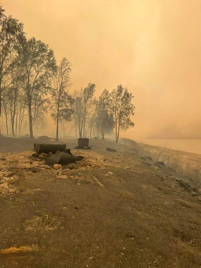 The Northwest Territories government says several cabins near Tulita have likely been destroyed by a wildfire burning in the area. Destroyed recreational gear is seen in a burned out area along the bank of the Mackenzie River near Tulita, N.W.T., in an undated handout photo. THE CANADIAN PRESS/HO-Shawn Etchinelle, *MANDATORY CREDIT*