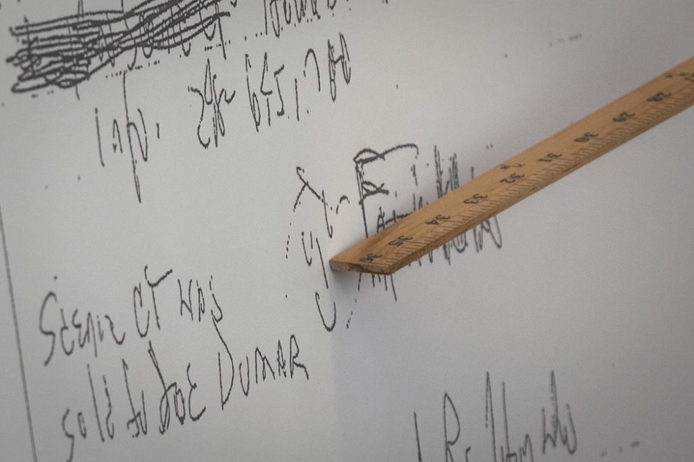 A smiley face written with Aretha Franklin's signature in 2014 is seen during the first day of a jury trial over Franklin's wills at Oakland County Probate Court in Pontiac, Mich., on Monday, July 10, 2023. Lawyers for two of Aretha Franklin’s sons urged a Michigan jury Tuesday, July 11, 2023, to declare a 2014 document as the music superstar's final will, saying there’s nothing legally significant about finding the handwritten papers in a notebook in her couch. (Sarahbeth Maney/Detroit Free Press via AP)