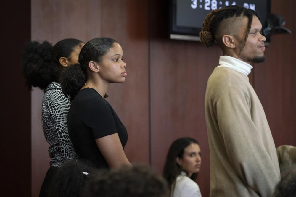 Grandchildren of Aretha Franklin Victorie Franklin, 24, left, Grace Franklin, 17, and Jordan Franklin, 28, stand for the jury during a trial over their grandmother's wills at Oakland County Probate Court in Pontiac, Mich., on Monday, July 10, 2023. Lawyers for two of Aretha Franklin’s sons urged a Michigan jury Tuesday, July 11, 2023, to declare a 2014 document as the music superstar's final will, saying there’s nothing legally significant about finding the handwritten papers in a notebook in her couch. (Sarahbeth Maney/Detroit Free Press via AP)