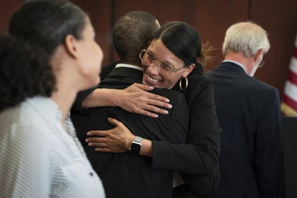 Kecalf Franklin, 53, the youngest son of Aretha Franklin, is embraced by his wife Kafi Franklin, 48, after a jury decided in favor of a 2014 document during a trial over his mother's wills at Oakland County Probate Court in Pontiac, Mich., on Tuesday, July 11, 2023. The Queen of Soul died in 2018 at age 76. (Sarahbeth Maney/Detroit Free Press via AP)