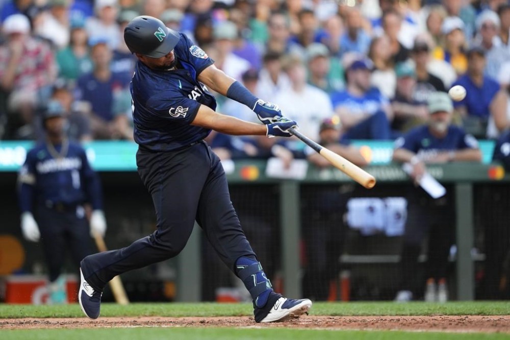 National League's Elias Díaz, of the Colorado Rockies (35), hits a two run home run in the eighth inning during the MLB All-Star baseball game in Seattle, Tuesday, July 11, 2023. (AP Photo/Lindsey Wasson)
