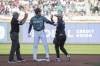 American League's Shohei Ohtani, of the Los Angeles Angels, is greeted by National League's Luis Arraez, of the Miami Marlins, after advancing to second base on a wild pitch in the fourth inning of the MLB All-Star baseball game in Seattle, Tuesday, July 11, 2023. (AP Photo/Ted S. Warren)