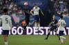 Kamal Miller, of Canada, headers the ball over Christian Pulisic of the United States during the second half of a CONCACAF Nations League final match Sunday, June 18, 2023, in Las Vegas. (AP Photo/John Locher)