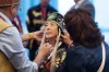 A First Nations leader from New Brunswick implored others to help stop social media attacks being launched at the Assembly of First Nations new interim chief. Newly-appointed Interim National Chief of the Assembly of First Nations Joanna Bernard, centre, gets help adjusting her regalia before leading the grand procession during the AFN annual general assembly in Halifax on Tuesday, July 11, 2023. THE CANADIAN PRESS/Darren Calabrese