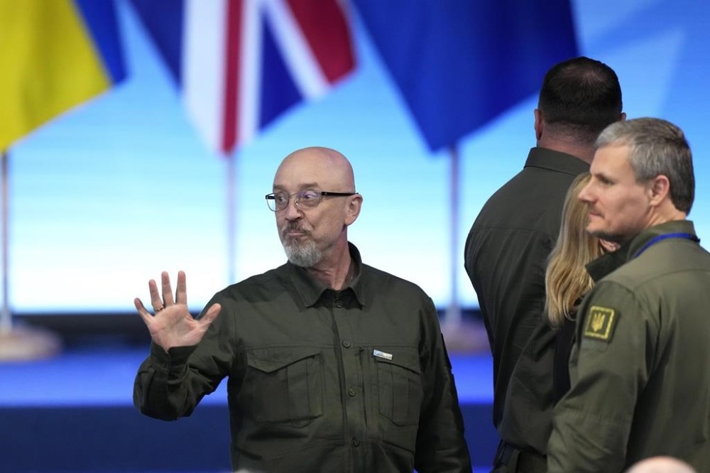 Ukraine's Defense Minister Oleksiy Reznikov, left, attends a media conference with G7 countries and Ukraine's President Volodymyr Zelenskyy during a NATO summit in Vilnius, Lithuania, Wednesday, July 12, 2023. (AP Photo/Pavel Golovkin)