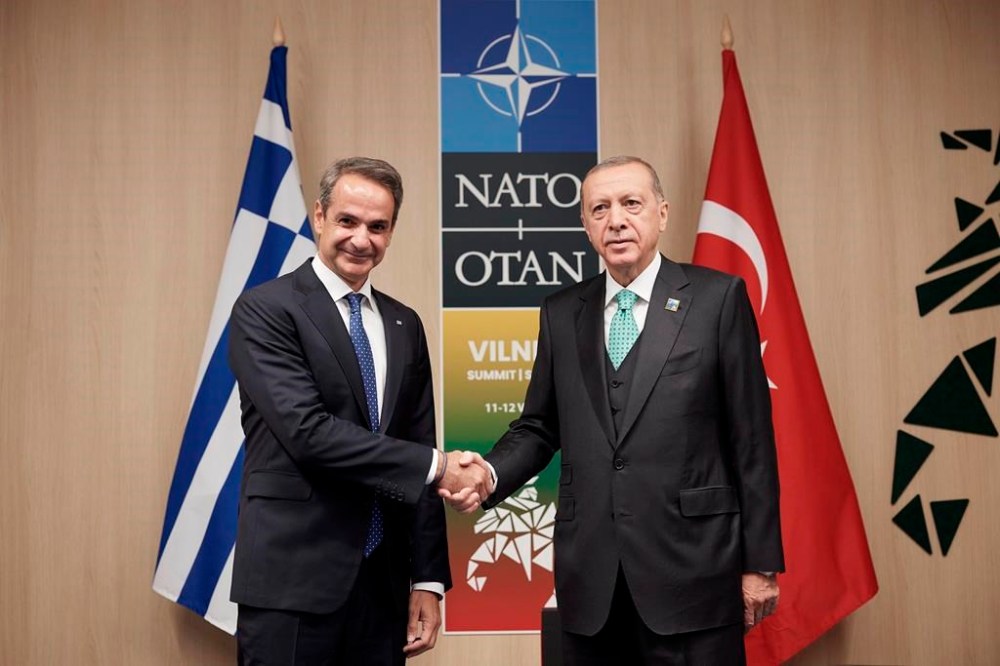 In this photo provided by the Greek Prime Minister's Office, Greece's Prime Minister Kyriakos Mitsotakis, left, shakes hands with Turkey's President Recep Tayyip Erdogan during their meeting at the NATO Summit, in Vilnius, Lithuania, Wednesday, July 12, 2023. Mitsotakis held an hourlong meeting Wednesday with Erdogan on the sidelines of a NATO summit in Vilnius, and told reporters they had agreed to continue high-level contacts. (Dimitris Papamitsos/Greek Prime Minister's Office via AP)