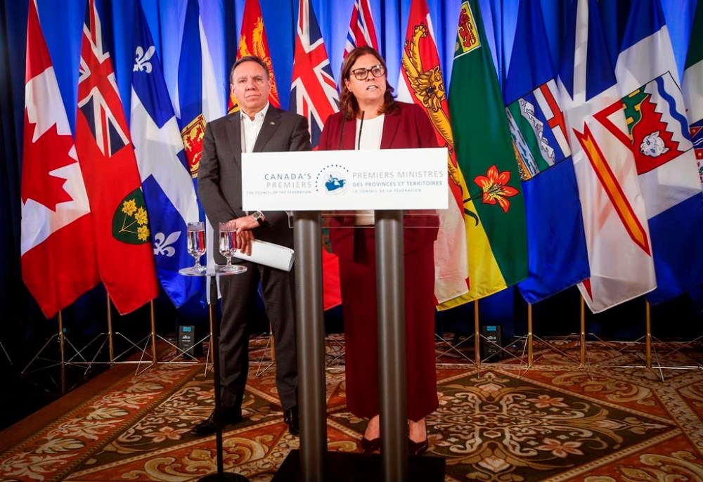 Manitoba Premier Heather Stefanson, who chairs the Council of the Federation, speaks to media as Quebec Premier François Legault listens at the annual premiers meeting at The Fort Garry Hotel in Winnipeg, Tuesday, July 11, 2023. THE CANADIAN PRESS/John Woods