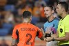 Houston Dynamo defender Franco Escobar (2) pushes Minnesota United defender Zarek Valentin, center, in front of referee Marcos DeOliveira, right, after Escobar received a yellow card from DeOliveira during the second half of an MLS soccer match Wednesday, July 12, 2023, in Houston. (AP Photo/Michael Wyke)