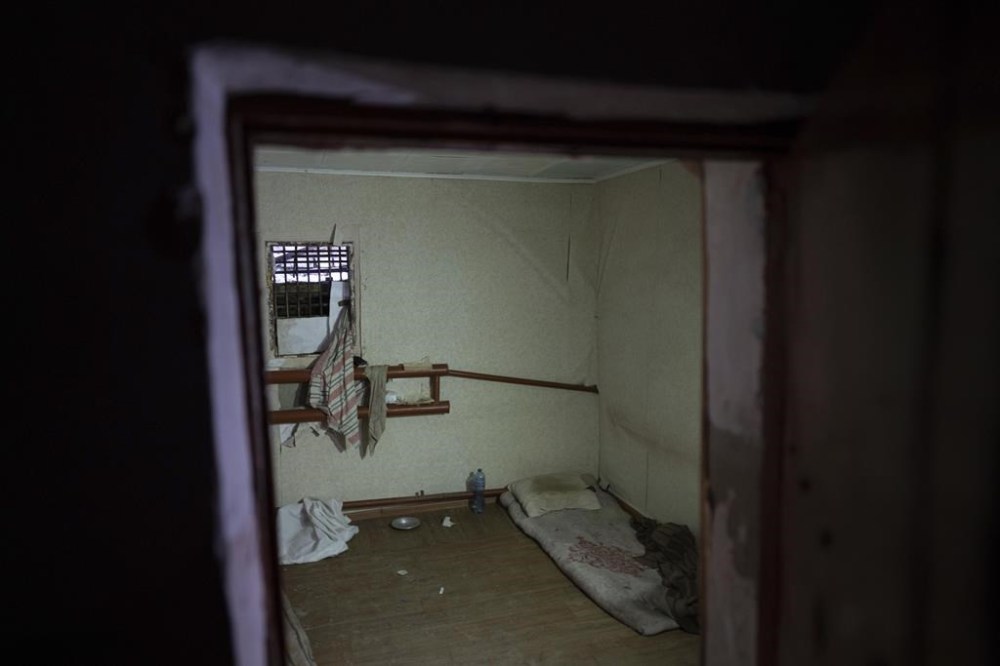 Bars cover a window of a room in a police department in Izium, Ukraine, Thursday, Sept. 22, 2022. Ukrainian civilians said they were held and tortured at this site by Russian soldiers. (AP Photo/Evgeniy Maloletka)