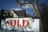 A report by Royal LePage says the average home price in Canada in the second quarter edged lower compared with a year ago. A real estate sold sign is shown in a Toronto west end neighbourhood May 16, 2020. THE CANADIAN PRESS/Graeme Roy
