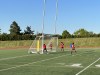 Youth soccer players move a net into position at Centennial Park in Toronto on May 25, 2023. THE CANADIAN PRESS/Liam Casey