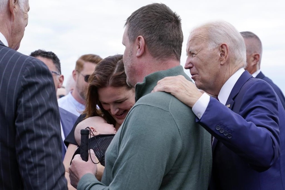 President Joe Biden greets embassy staff and their families before boarding Air Force One at Helsinki-Vantaan International Airport in Helsinki, Finland, Thursday, July 13, 2023. Biden is returning to Washington after meeting with Nordic leaders in Helsinki and attending the NATO Summit in Vilnius, Lithuania. (AP Photo/Susan Walsh)