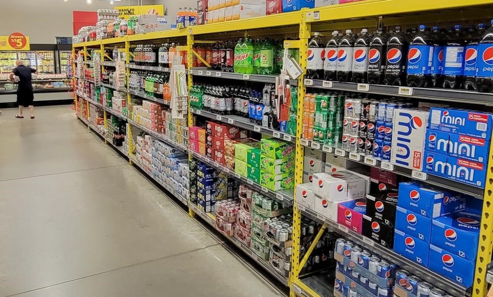 A customer walks down a grocery store's drinks aisle in Newcastle, Ont. on Thursday July 13, 2023. The Canadian Cancer Society and Health Canada are reviewing the World Health Organization's classification of aspartame as