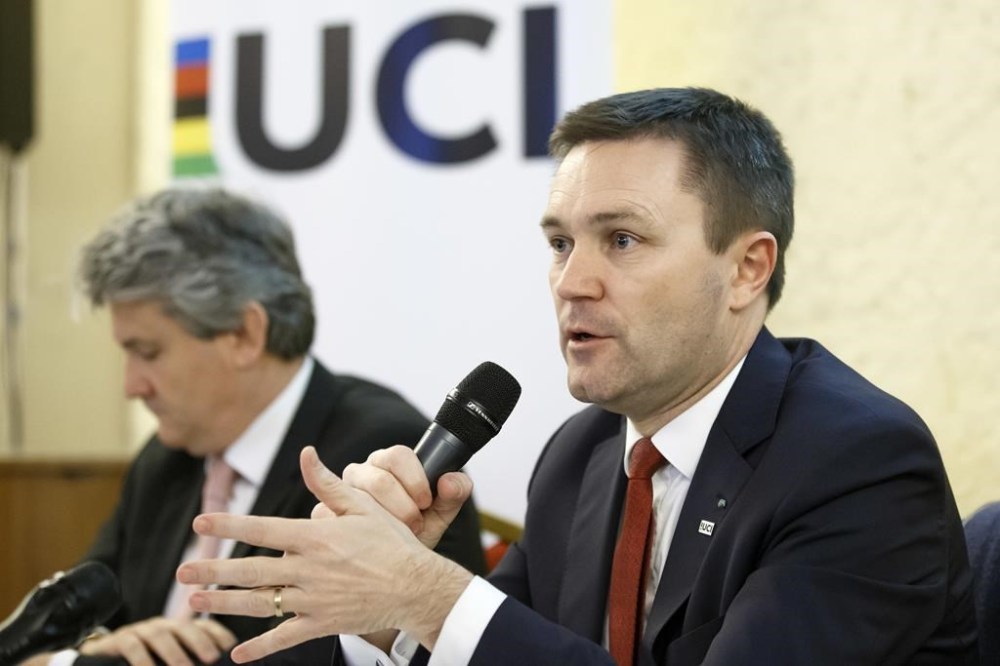 FILE - UCI President David Lappartient, right, speaks to the media about the fight against technological fraud during a press conference in Geneva, Switzerland, Wednesday, March 21, 2018. Female transgender athletes who transitioned after male puberty will no longer be able to compete in women's races, world cycling governing body the UCI said Friday, July 14, 2023. Despite the ban, Lappartient said “the UCI would like to reaffirm that cycling — as a competitive sport, leisure activity or means of transport — is open to everyone, including transgender people, whom we encourage like everyone else to take part in our sport.