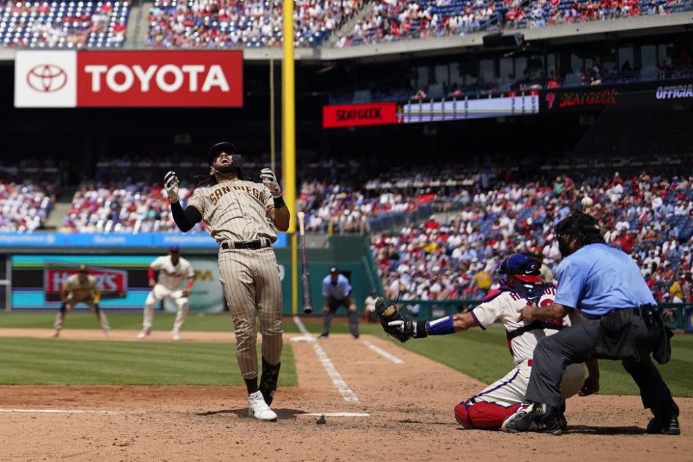 San Diego Padres' Fernando Tatis Jr. is hit by a pitch from Philadelphia Phillies' Yunior Marte during the seventh inning of the first baseball game in a doubleheader, Saturday, July 15, 2023, in Philadelphia. (AP Photo/Matt Slocum)