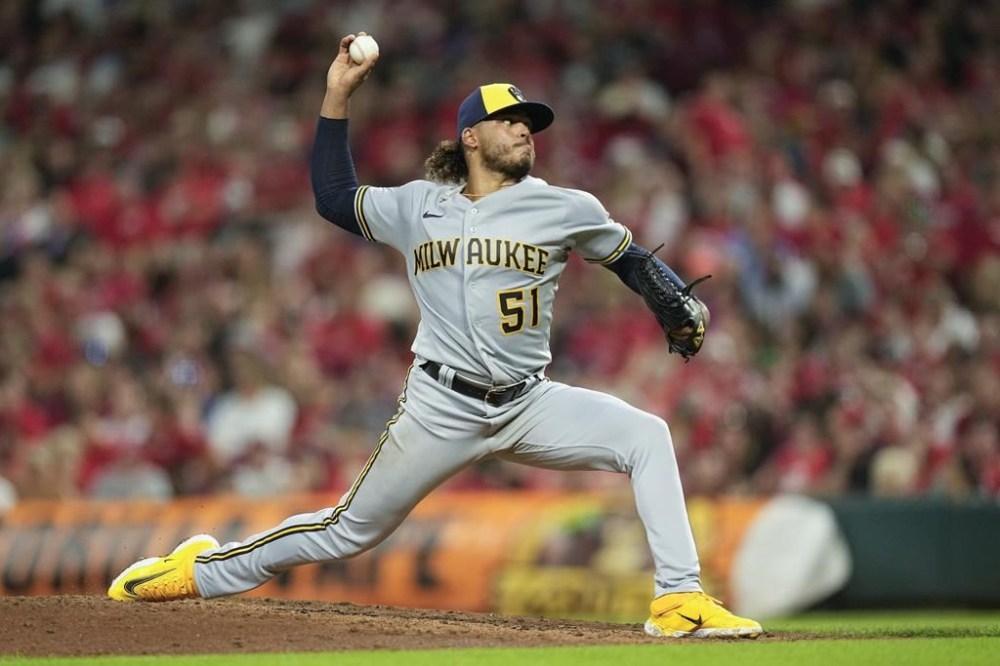 Milwaukee Brewers starting pitcher Freddy Peralta throws during the sixth inning of a baseball game against the Cincinnati Reds, Saturday, July 15, 2023, in Cincinnati. (AP Photo/Darron Cummings)