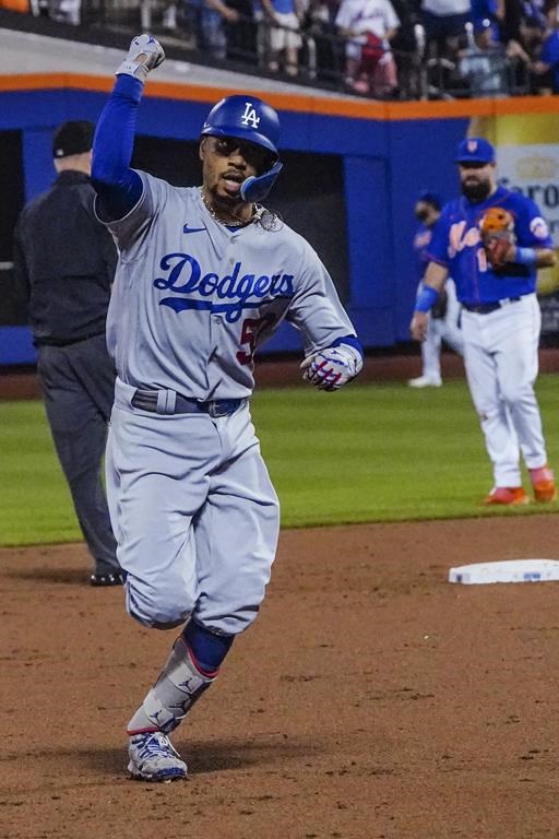 Los Angeles Dodgers' Mookie Betts pumps his fist as he runs the bases after his home run against the New York Mets during the third inning of a baseball game Saturday, July 15, 2023, in New York. (AP Photo/Bebeto Matthews)