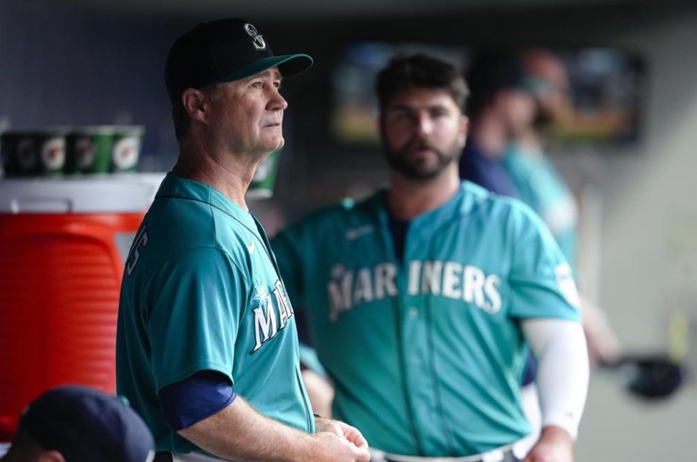 Seattle Mariners manager Scott Servais stands in the dugout during the seventh inning of the team's baseball game against the Detroit Tigers, Saturday, July 15, 2023, in Seattle. (AP Photo/Lindsey Wasson)