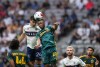 Los Angeles Galaxy's Kelvin Leerdam (18) and Vancouver Whitecaps' Brian White (24) vie for the ball during the first half of an MLS soccer match in Vancouver, B.C., Saturday, July 15, 2023. THE CANADIAN PRESS/Darryl Dyck