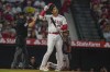 Los Angeles Angels designated hitter Shohei Ohtani takes off his helmet after swinging for a strike during the seventh inning of a baseball game against the Houston Astros, Saturday, July 15, 2023, in Anaheim, Calif. (AP Photo/Ryan Sun)