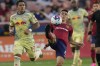 Real Salt Lake midfielder Braian Ojeda (6) kicks the ball next to New York Red Bulls midfielder Wikelman Carmona (19) during the first half of an MLS soccer match Saturday, July 15, 2023, in Sandy, Utah. (AP Photo/Rick Bowmer)