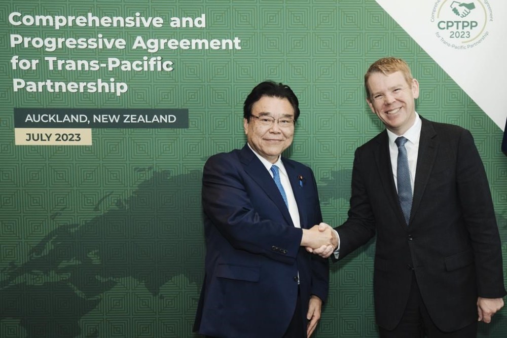 Japan's Minister of Economic & Fiscal Policy Shigeyuki Goto, left, meets with New Zealand Prime Minister Chris Hipkins at the Trans-Pacific Partnership (TPP) Ministerial Meeting in Auckland, New Zealand, Sunday, July 16, 2023. (Smoke Photography via AP)