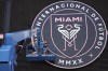 Workers refresh details on a logo on the outside of DRV Pink Stadium, home of Inter Miami MLS soccer club, Monday, July 10, 2023, in Fort Lauderdale, Fla. Inter Miami has announced plans to present new players including Argentine superstar Lionel Messi in an event on July 16. (AP Photo/Rebecca Blackwell)