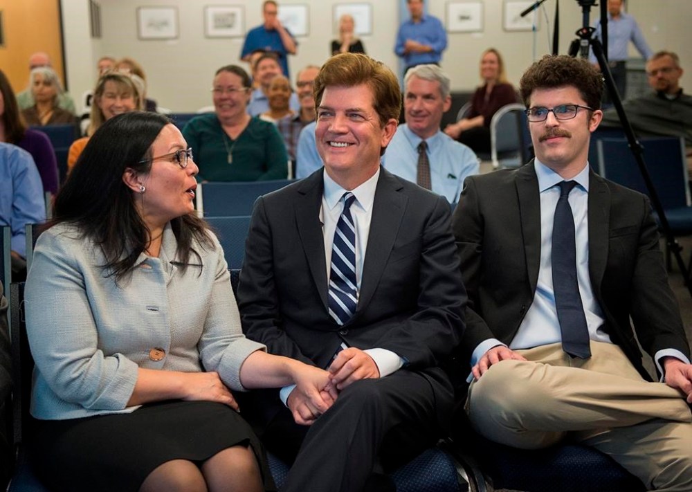 FILE - Sacramento Bee editorial cartoonist Jack Ohman reacts to winning the Pulitzer Prize for Editorial Cartooning as he sits with friend Mandy Sittrop, left, and his son, Eric Ohman, right, on April 18, 2016, in Sacramento, Calif. Ohman was among three Pulitzer Prize-winning editorial cartoonists who were laid off last week. (Lezlie Sterling/The Sacramento Bee via AP)