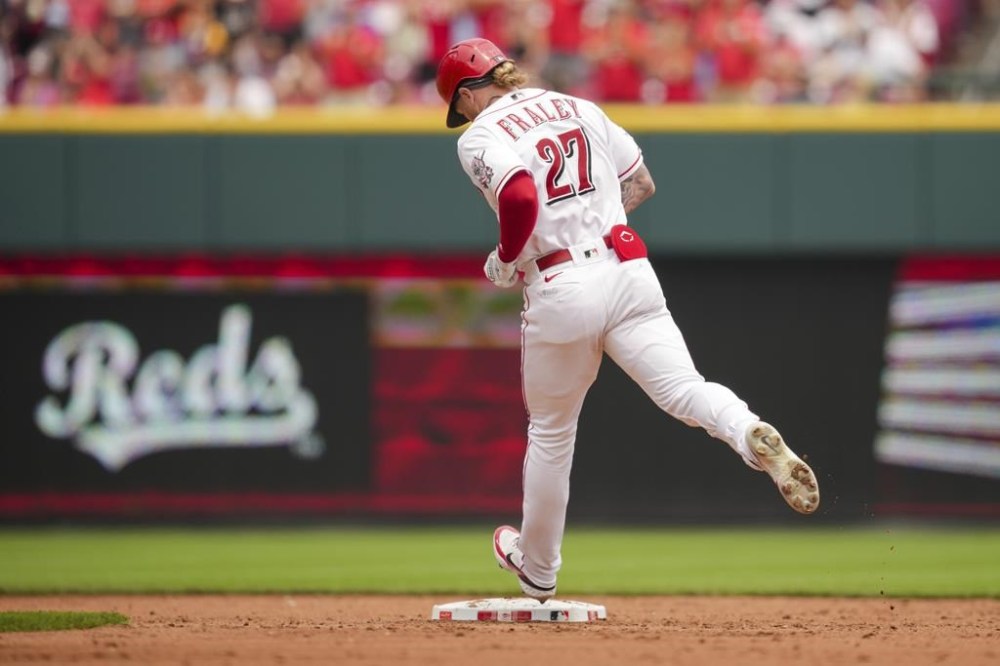 Cincinnati Reds' Jake Fraley runs the bases after hitting a two-run home run during the third inning of a baseball game against the Milwaukee Brewers in Cincinnati, Sunday, July 16, 2023. (AP Photo/Aaron Doster)