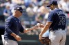 Tampa Bay Rays manager Kevin Cash takes the ball from relief pitcher Yonny Chirinos to make a pitching change during the eighth inning of a baseball game against the Kansas City Royals Sunday, July 16, 2023, in Kansas City, Mo. The Royals won 8-4. (AP Photo/Charlie Riedel)