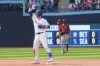 Toronto Blue Jays' Danny Jansen celebrates as he stands on second base after hitting a three RBI double off Arizona Diamondbacks relief pitcher Scott McGough during eighth inning interleague MLB baseball action in Toronto, Sunday, July 16 2023. THE CANADIAN PRESS/Chris Young