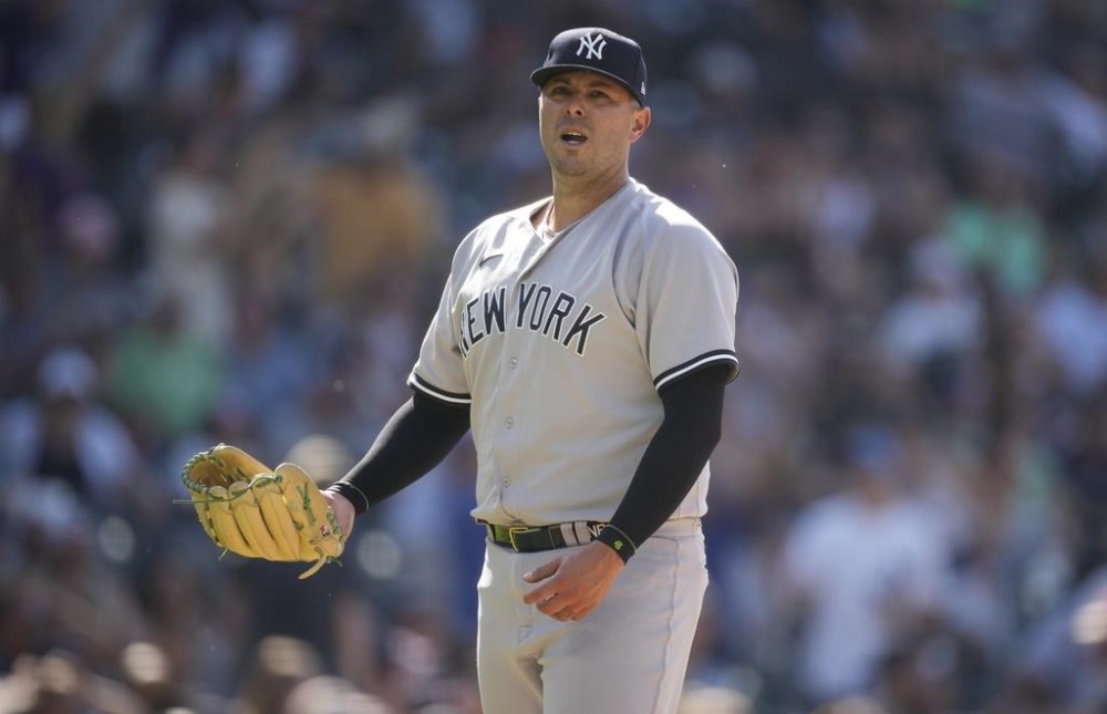 New York Yankees relief pitcher Nick Ramirez reacts after giving up a two-run home run to Colorado Rockies' Nolan Jones in the 11th inning of a baseball game Sunday, July 16, 2023, in Denver. (AP Photo/David Zalubowski)