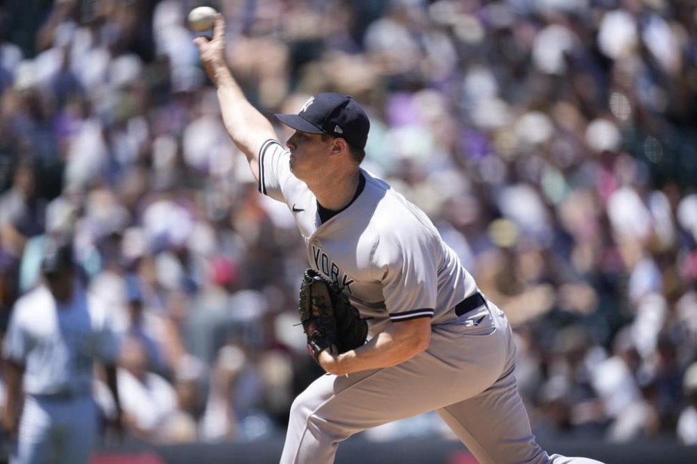 New York Yankees starting pitcher Gerrit Cole works against the Colorado Rockies in the first inning of a baseball game Sunday, July 16, 2023, in Denver. (AP Photo/David Zalubowski)