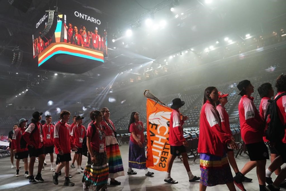 The North American Indigenous Games have officially opened, with the prime minister attending as thousands of Indigenous athletes from across the continent filled the downtown Halifax Forum Civic Centre. An athlete from Team Ontario carries a